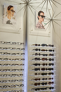 assorted-framed sunglasses and eyeglasses lot on shelves thumbnail