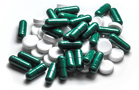 assorted medication pills on white surface thumbnail