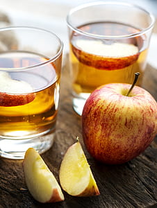apple fruit beside shot glasses thumbnail