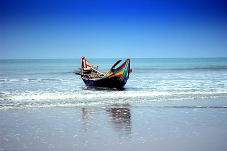 multicolored boat floating on water thumbnail