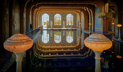 photo of person standing near indoor pool thumbnail