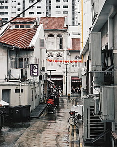 bicycle parked beside building thumbnail