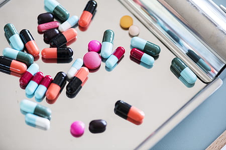 capsules and medication pill on top of table thumbnail
