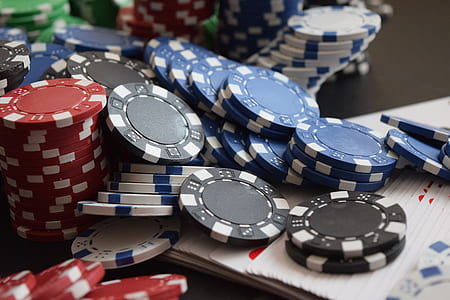 poker chips on white paper thumbnail