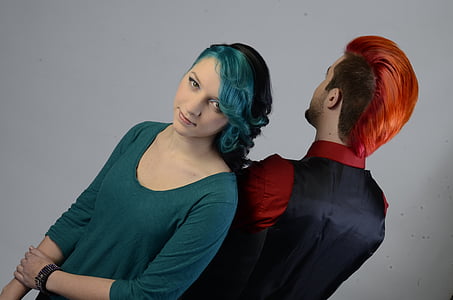 woman standing beside man with red hair thumbnail