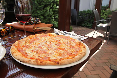 pizza on white plate thumbnail
