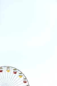 Ferris wheel with yellow and red carts thumbnail