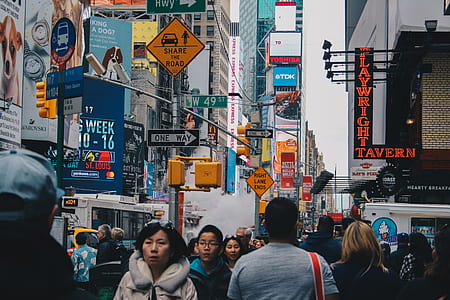 crowd of people passing through the street thumbnail