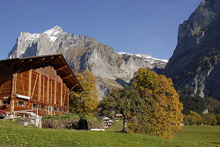 brown house beside mountain range during daytime thumbnail