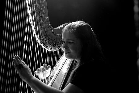 woman playing harp grayscale photo thumbnail