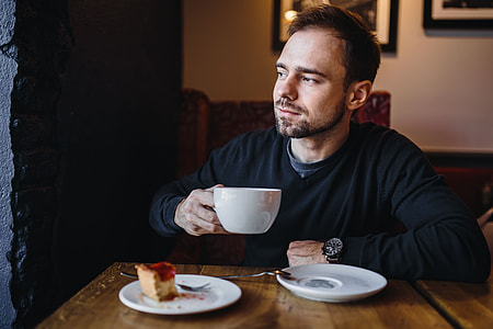 Young Elegantly dressed man sititng in a cafe thumbnail