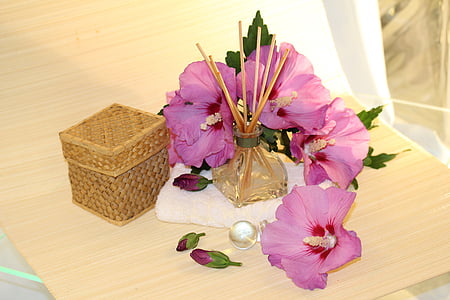 pink hibiscus flower on beige textile thumbnail