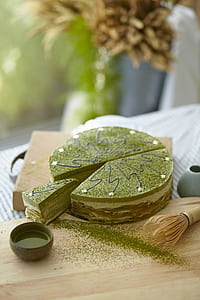 round sliced cake on top of brown surface thumbnail