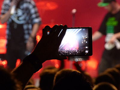 person holding black video recorder thumbnail