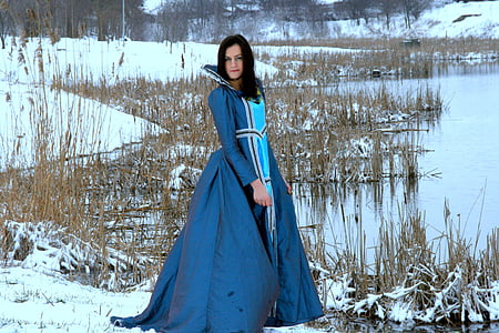 woman standing near lake during daytime thumbnail