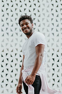 man wearing white t-shirt and blue bottoms thumbnail