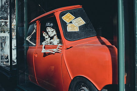 red MINI Cooper with skeleton inside thumbnail