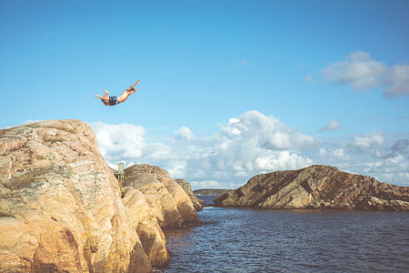 time lapse photography of man diving on beach thumbnail