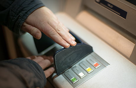 person holding gray machine thumbnail