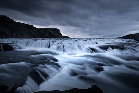 waterfalls under white sky thumbnail