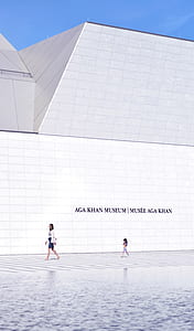 woman and girl walking beside a museum thumbnail