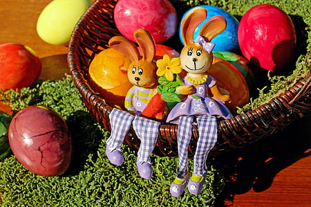 round wicker basket with assorted-color eggs thumbnail