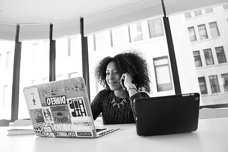 Grayscale Photo of Woman Using Laptop thumbnail