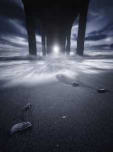 low-angle photo of sand under the bridge at night time thumbnail