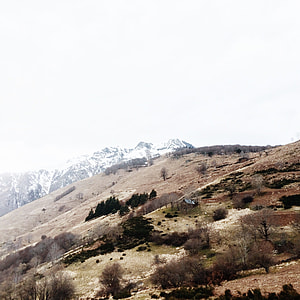 aerial photography of brown house on hill during daytime thumbnail
