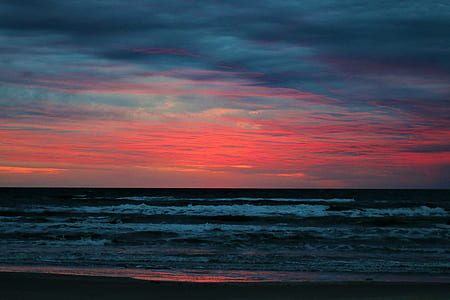 sea waves under cloudy sky thumbnail