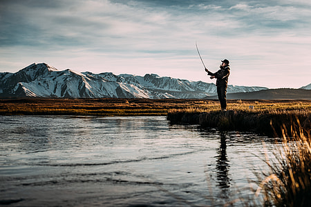 man stands near body of water thumbnail
