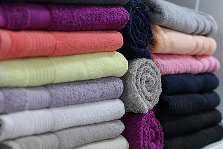 assorted-color folded towels thumbnail