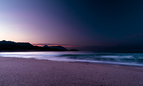 shore beside body of water thumbnail