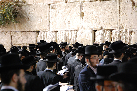 crowd of people wearing black suit and black cap thumbnail