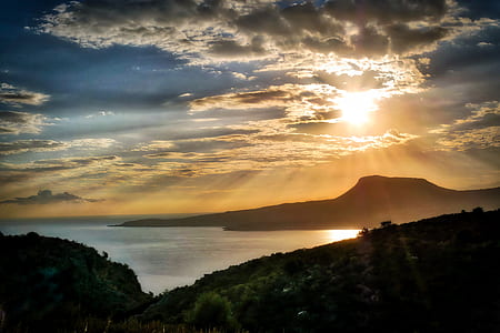 silhouette of mountain at golden hour thumbnail
