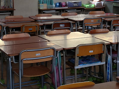 close-up photo of brown wooden table with chairs thumbnail