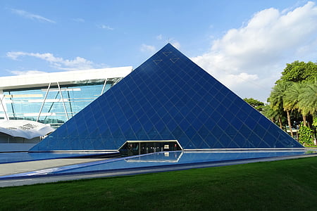 blue pyramid glass building during daytime thumbnail