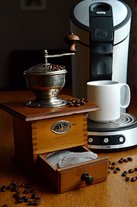 brown wooden coffee grinder near coffeemaker thumbnail