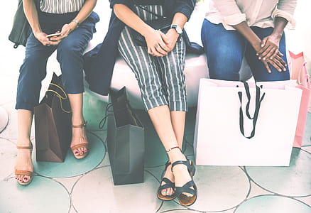 three women sitting beside each other thumbnail