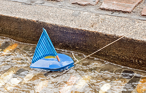 photography of boat toy during daytime thumbnail