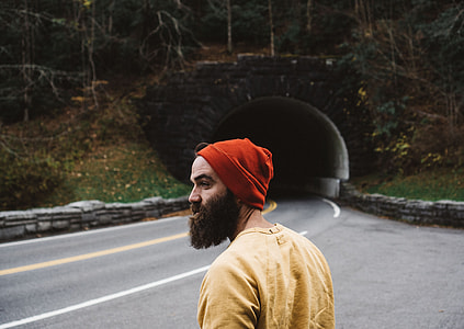 man standing near road and tunnel at distance thumbnail