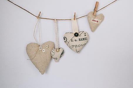 heart-shaped pillows hanging on wall thumbnail