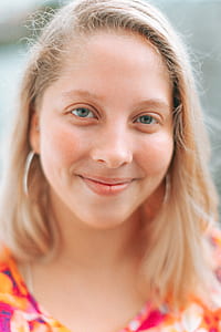woman smiling while looking at camera thumbnail