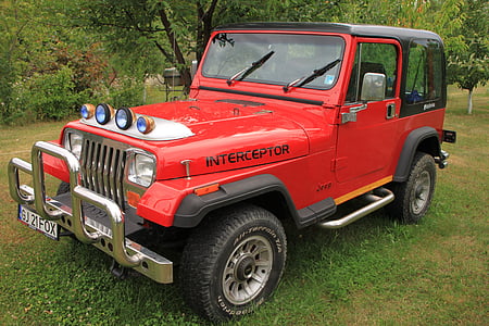 red and black Jeep Wrangler thumbnail