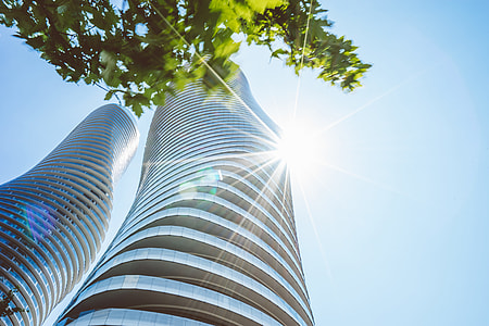 low angle photography of twisted building thumbnail