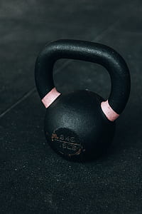 closeup photo of black kettle bell on ground thumbnail