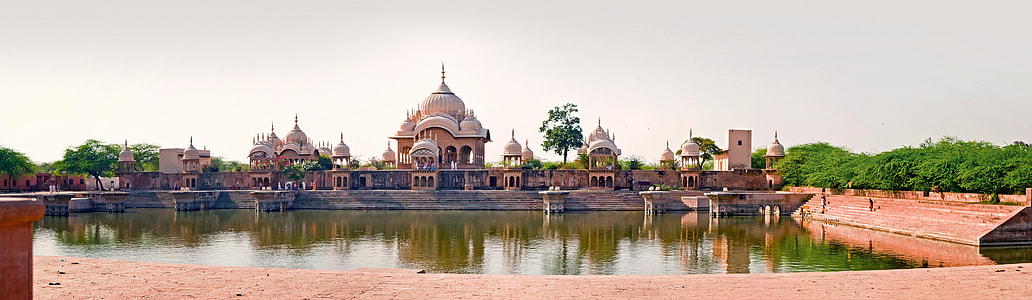 orange concrete buildings near body of water wallpaper thumbnail