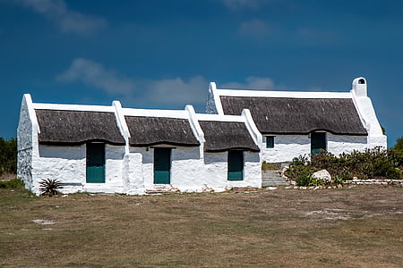 architectural photography of white-and-black duplex structures thumbnail