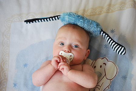 baby with white pacifier thumbnail