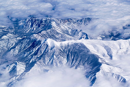 snow mountain under gray cloudy sky thumbnail